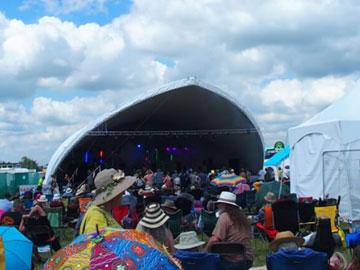 Crowds gathered in front of a stage.