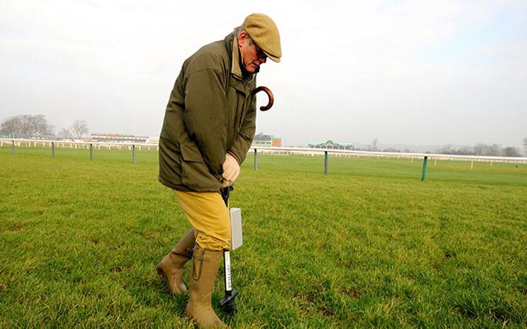Clerk of the Course at Uttoxeter Racecourse checking the going on the track.