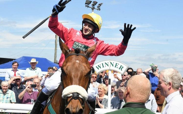 Jockey Andrew Thornton on a horse celebrating his retirement.