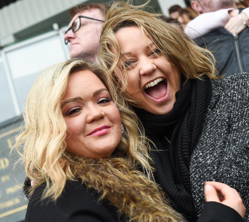 Two excited race goers.