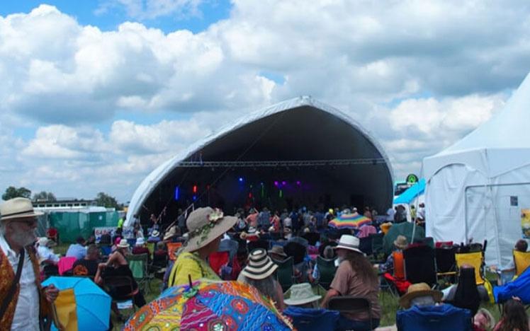 Crowds gathered in front of a stage.