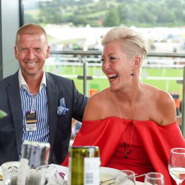 A couple with prime restaurant seats at Uttoxeter races