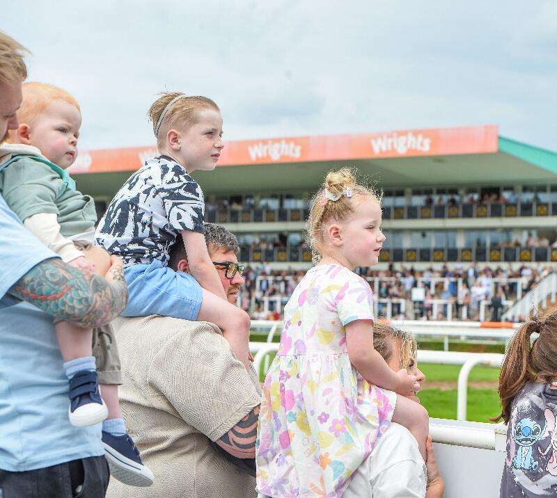 Family watching a race.