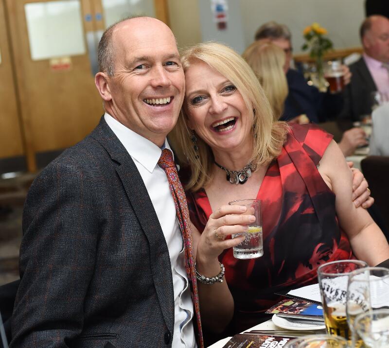 A happy couple pose for the camera at their hospitality table at Uttoxeter Races.